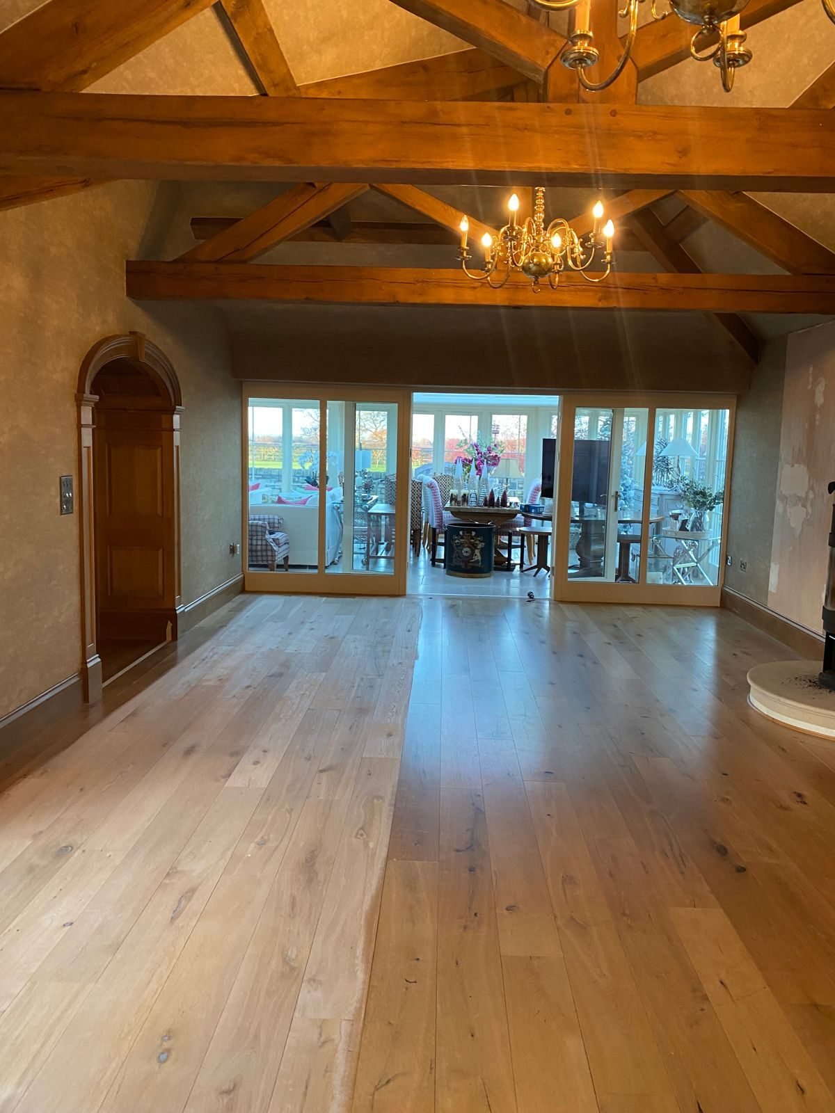 Sanded oak floor in a living room with exposed beams